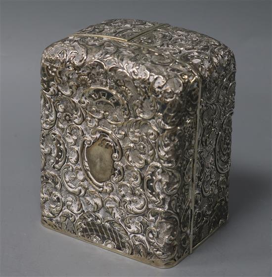 An ornate silver clock case by Walker & Hall,